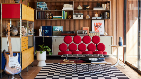 A Nelson Marshmallow Sofa, Eames Wire Base Tables, Nelson Pedestal Table, and a 4x2 Eames Storage Unit. our-values