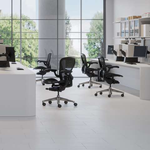 Aeron ESD Chairs in a light lab space with two desks and stations with monitors, books, and manuals. Aeron ESD Chairs in a light lab space with two desks and stations with monitors, books, and manuals.