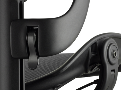 Detailed view of the Aeron arm height-adjustment feature in a black matte finish. Detailed view of the Aeron arm height-adjustment feature in a black matte finish.