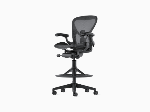 An Aeron Stool on a white background with a 5-star base and ergonomic back support, viewed at an angle. An Aeron Stool on a white background with a 5-star base and ergonomic back support, viewed at an angle.