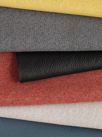 Swatches of Maharam Luce, Meld and Stow leather in multiple colors folded against each other. Swatches of Maharam Luce, Meld and Stow leather in multiple colors folded against each other.