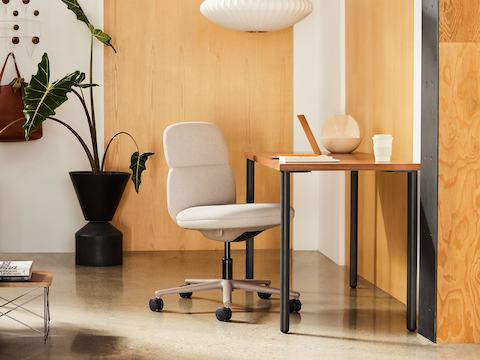 Mid-back Asari chair by Herman Miller in cream in a wooden paneled room with OE1 rectangular table and cream Wilkes sofa. Mid-back Asari chair by Herman Miller in cream in a wooden paneled room with OE1 rectangular table and cream Wilkes sofa.