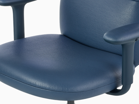 Top angle view of a mid-back Asari chair in dark blue with height adjustable arms. Top angle view of a mid-back Asari chair in dark blue with height adjustable arms.
