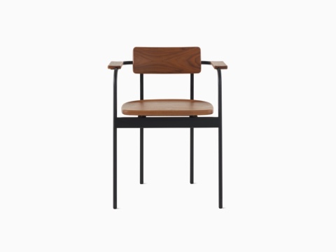 A Betwixt Chair with a walnut backrest, seat, and arms with a black frame. A Betwixt Chair with a walnut backrest, seat, and arms with a black frame.