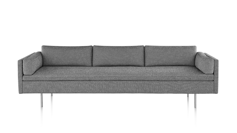 Bolster Sofa with heathered gray upholstery and satin chrome base, viewed from the front. Bolster Sofa with heathered gray upholstery and satin chrome base, viewed from the front.