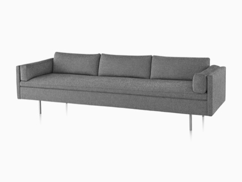 Gray three-seat Bolster Sofa, fiewed from the front at an angle. Gray three-seat Bolster Sofa, fiewed from the front at an angle.