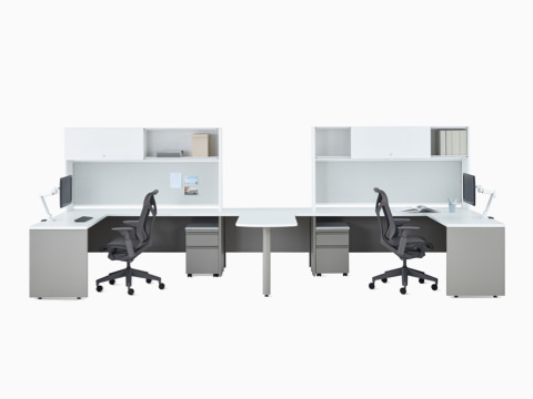 Two white and gray Canvas Metal Desks with upper storage, Concerto Monitor Arm, and dark gray Cosm Chair. Two white and gray Canvas Metal Desks with upper storage, Concerto Monitor Arm, and dark gray Cosm Chair.