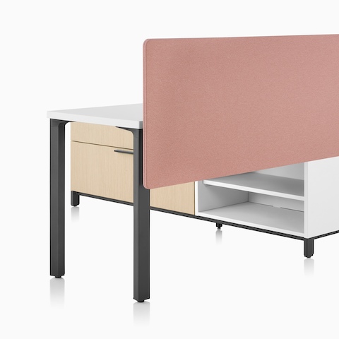 A Canvas Storage workstation in light wood with a white surface, pink screen, and graphite legs. A Canvas Storage workstation in light wood with a white surface, pink screen, and graphite legs.