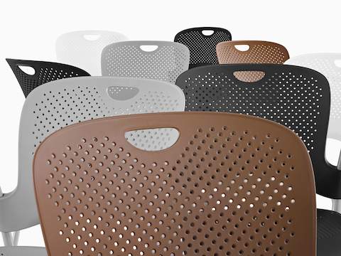 White, black, gray, and brown Caper Stacking Chairs. White, black, gray, and brown Caper Stacking Chairs.