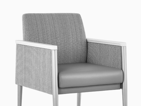 Front three-quarter view of Palisade Chair in gray fabric. our-values