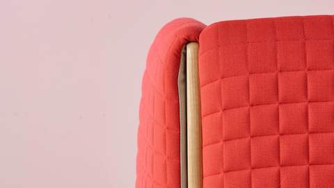 Close view of a red fabric on a ColourForm seating piece. Close view of a red fabric on a ColourForm seating piece.