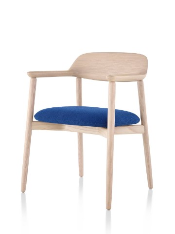 Crosshatch Side Chair with a light finish and blue seat cushion, viewed from a 45-degree angle. Crosshatch Side Chair with a light finish and blue seat cushion, viewed from a 45-degree angle.