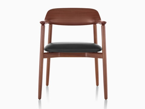 The upper half of a Crosshatch Side Chair with a dark finish and black seat cushion, viewed from the front. The upper half of a Crosshatch Side Chair with a dark finish and black seat cushion, viewed from the front.