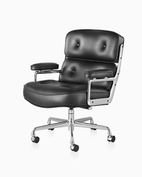 Black leather Eames Executive Chair, offering a close view of the thickly cushioned seat, back, and arms. Black leather Eames Executive Chair, offering a close view of the thickly cushioned seat, back, and arms.