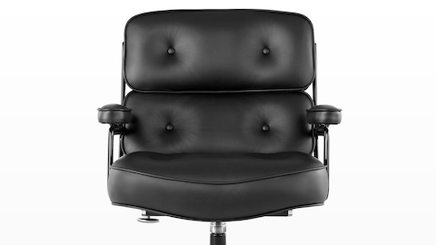 Close view of a black leather Eames Executive Chair, showing the thickly padded seat, back, and arms. Close view of a black leather Eames Executive Chair, showing the thickly padded seat, back, and arms.