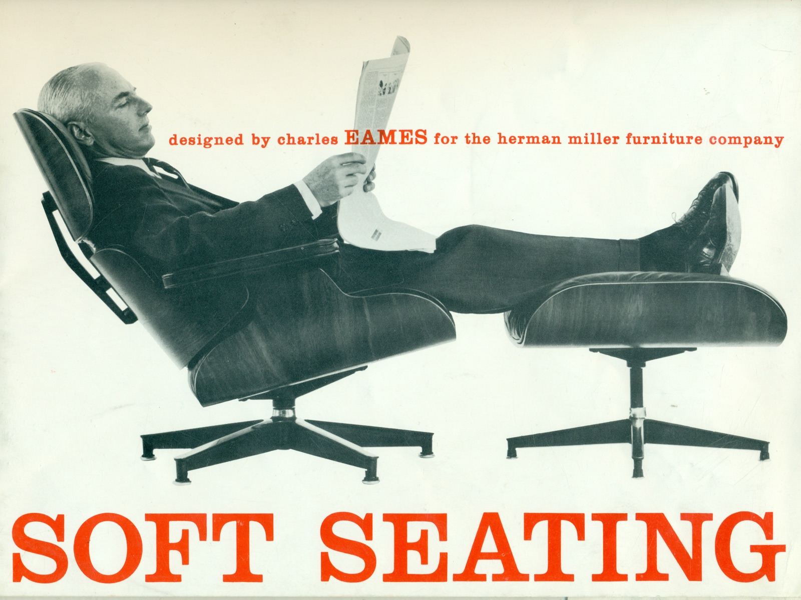 Vintage black-and-white photo of a man reading a newspaper while reclining in an Eames Lounge Chair and Ottoman. Vintage black-and-white photo of a man reading a newspaper while reclining in an Eames Lounge Chair and Ottoman.