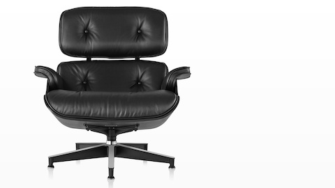 Black leather Eames Lounge Chair with a black shell, viewed from the front. Black leather Eames Lounge Chair with a black shell, viewed from the front.