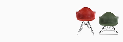 Two Eames Molded Fiberglass Armchairs, one with a wire base and one with a low wire base. Two Eames Molded Fiberglass Armchairs, one with a wire base and one with a low wire base.