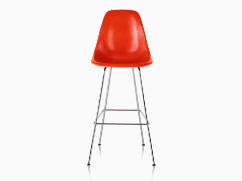 Upper half of a red Eames Molded Fiberglass Stool, viewed from the front. Upper half of a red Eames Molded Fiberglass Stool, viewed from the front.