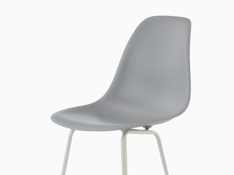 Upper half of a light blue Eames Molded Plastic Stool, viewed from a 45-degree angle. Upper half of a light blue Eames Molded Plastic Stool, viewed from a 45-degree angle.