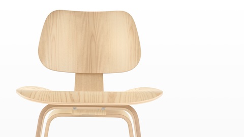 Close view of the upper half of an Eames Molded Plywood Chair with a light finish. Close view of the upper half of an Eames Molded Plywood Chair with a light finish.