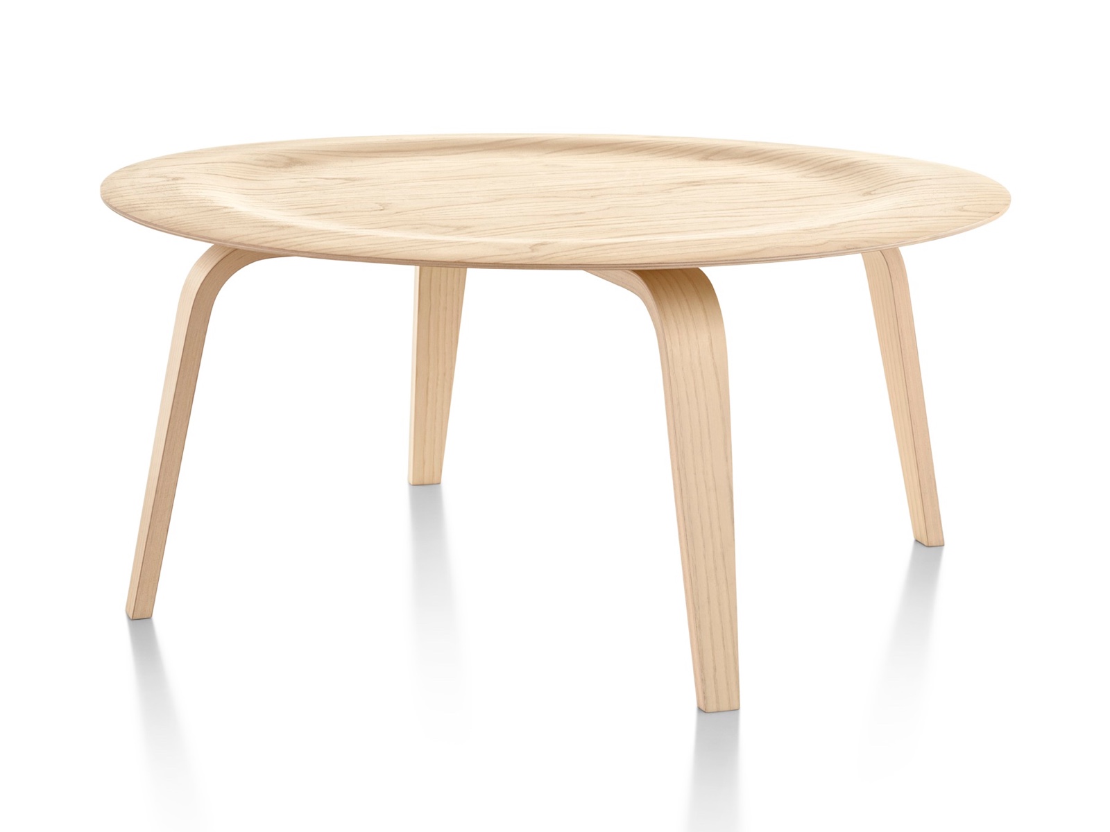 A round Eames Molded Plywood Coffee Table with wood legs and an indented top in a light finish. A round Eames Molded Plywood Coffee Table with wood legs and an indented top in a light finish.
