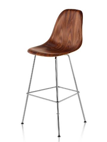 Eames Molded Wood Stool with a dark finish and silver legs, viewed from a 45-degree angle. Eames Molded Wood Stool with a dark finish and silver legs, viewed from a 45-degree angle.