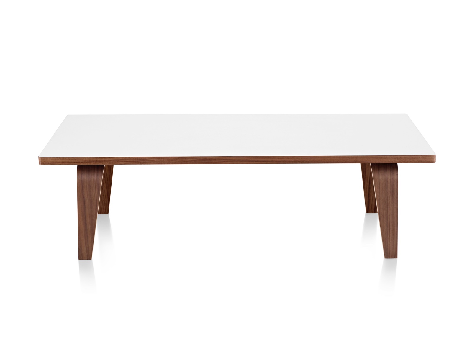 An Eames Rectangular Coffee Table with a white top and molded plywood legs in a medium finish. An Eames Rectangular Coffee Table with a white top and molded plywood legs in a medium finish.