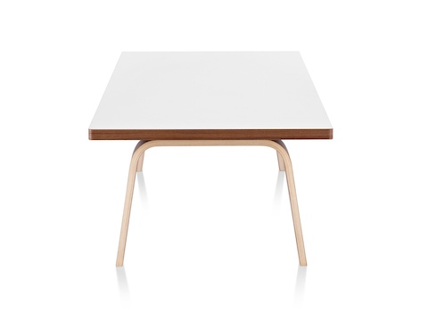 An Eames Rectangular Coffee Table with a white top, viewed from the narrow end. An Eames Rectangular Coffee Table with a white top, viewed from the narrow end.