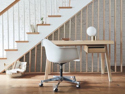 A residential work setting featuring an Eames Task Chair and Distil Desk. A residential work setting featuring an Eames Task Chair and Distil Desk.