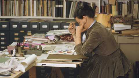 Ray at work with Eames Stool models in May 1960. Ray at work with Eames Stool models in May 1960.