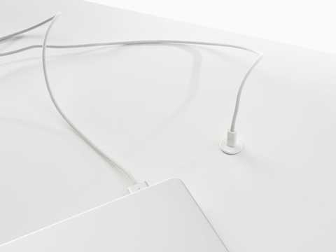 Ello Micro surface-integrated single port USB-C power solution shown in white charging a laptop. Ello Micro surface-integrated single port USB-C power solution shown in white charging a laptop.