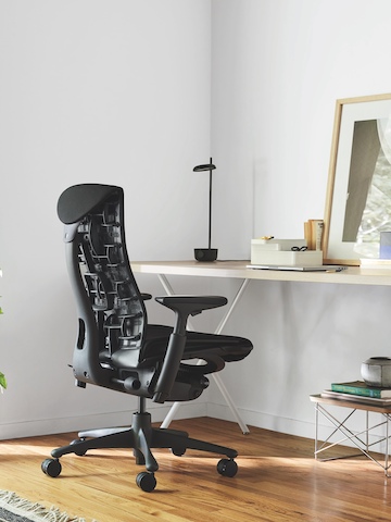 Black Embody office chair at a Nelson X-Leg Table. Black Embody office chair at a Nelson X-Leg Table.