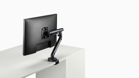 Flo Single monitor arm in black viewed at an angle. Flo Single monitor arm in black viewed at an angle.