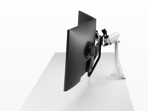 White dual Flo X monitor arm set up with 32'' screens, viewed from the side. White dual Flo X monitor arm set up with 32'' screens, viewed from the side.