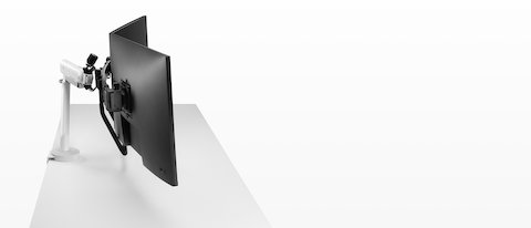 White dual Flo X monitor arm set up with 32'' screens, viewed from the side. White dual Flo X monitor arm set up with 32'' screens, viewed from the side.