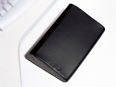 Overhead view of a black Foot Pillow. Overhead view of a black Foot Pillow.