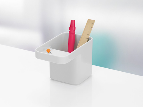 A white Formwork Pencil Cup containing a marker and ruler. A white Formwork Pencil Cup containing a marker and ruler.