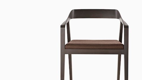 Full Twist Guest Chair with a dark wood finish and brown seat pad, viewed from the front. Full Twist Guest Chair with a dark wood finish and brown seat pad, viewed from the front.