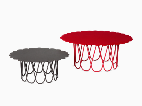 A small black and large red Girard Flower Table on a white background. A small black and large red Girard Flower Table on a white background.