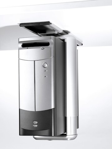 A silver CPU secured with an aluminum clamp seems to float beneath a work surface. A silver CPU secured with an aluminum clamp seems to float beneath a work surface.