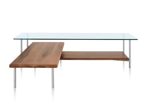 An L-shaped Layer glass top coffee table with two wood lower shelves. An L-shaped Layer glass top coffee table with two wood lower shelves.