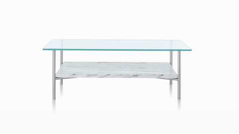 A rectangular Layer occasional table with a glass top and stone lower shelf. A rectangular Layer occasional table with a glass top and stone lower shelf.