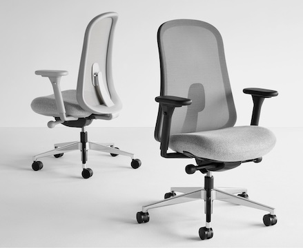 Two black and gray Lino Chairs with adjustable sacral lumbar support, viewed from the front and back at angles. Two black and gray Lino Chairs with adjustable sacral lumbar support, viewed from the front and back at angles.