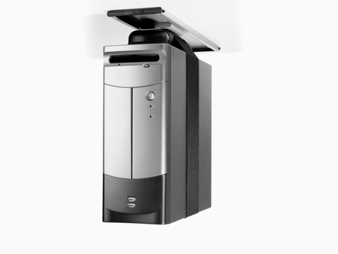 A silver CPU secured by a nylon strap and attached to the underside of a work surface with a Loop CPU Support. A silver CPU secured by a nylon strap and attached to the underside of a work surface with a Loop CPU Support.