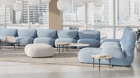 Luva Modular Sofa and Cyclade Tables in a commercial lounge setting. Luva Modular Sofa and Cyclade Tables in a commercial lounge setting.