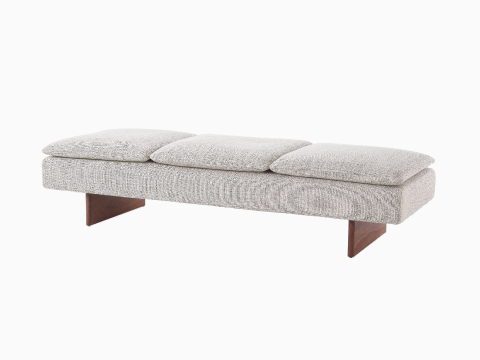 Angled view of a Mantle Bench upholstered in Capri Stone with a Walnut Wood Base. Angled view of a Mantle Bench upholstered in Capri Stone with a Walnut Wood Base.