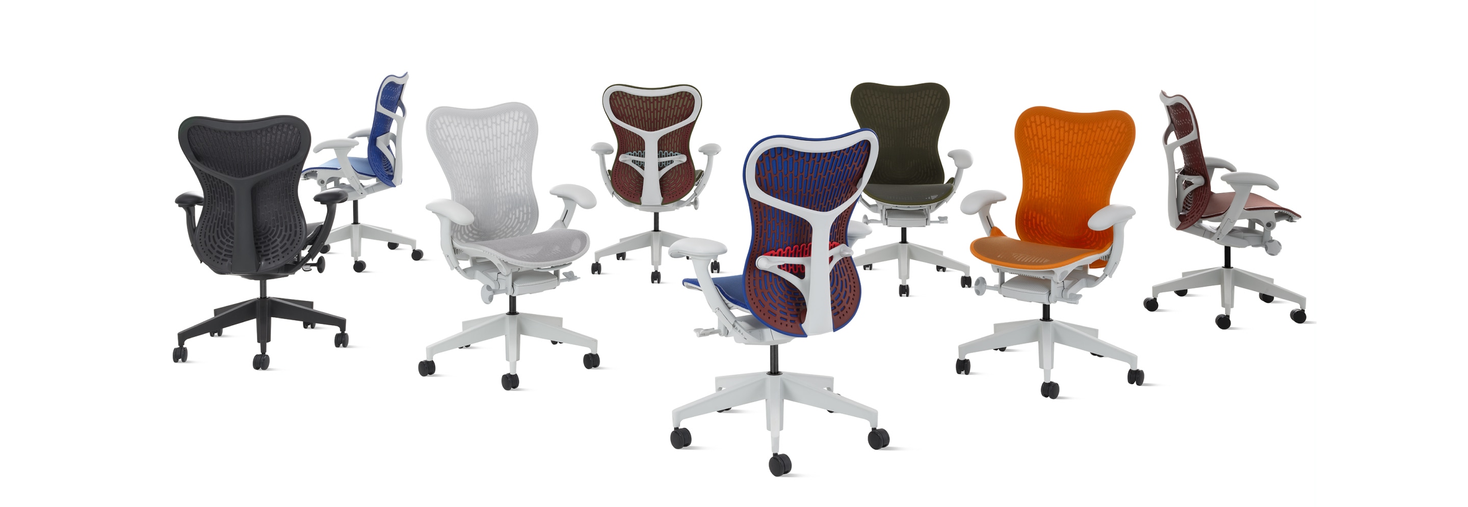 A group of eight Mirra 2 chairs in a row in multiple colors with Butterfly backs. A group of eight Mirra 2 chairs in a row in multiple colors with Butterfly backs.