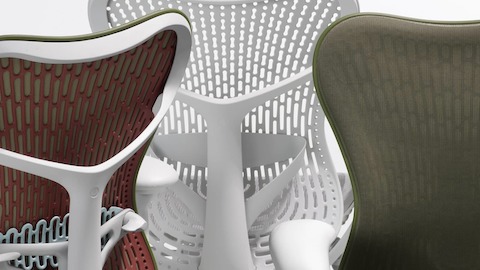 Close up of the backs for three Mirra 2 chairs. One is a color-block olive chair, one is an olive chair with a Butterfly back and the other is an alpine chair with a Triflex back. Close up of the backs for three Mirra 2 chairs. One is a color-block olive chair, one is an olive chair with a Butterfly back and the other is an alpine chair with a Triflex back.