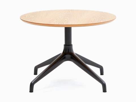 A NaughtOne Ali Café Table with a black 4-star base and circular oak veneer table top. A NaughtOne Ali Café Table with a black 4-star base and circular oak veneer table top.